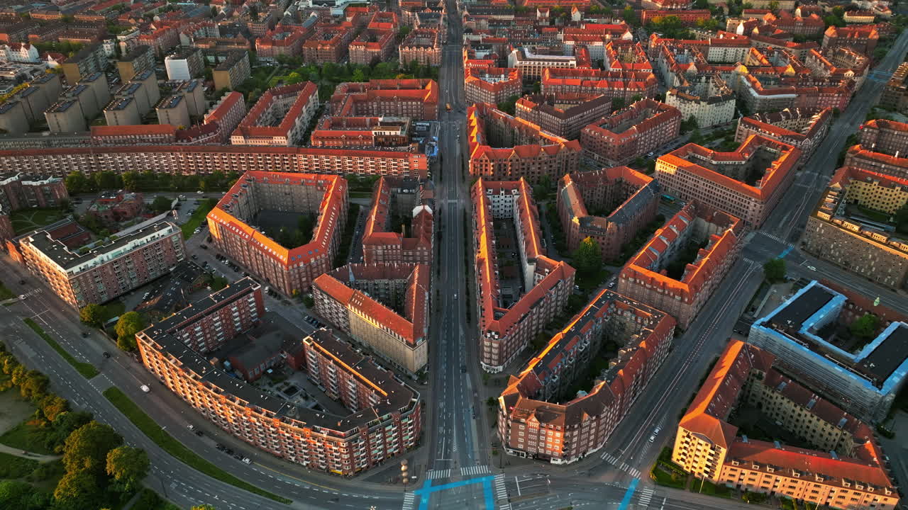 Aerial drone view of Amagerbro area in the northern part of the island Amager in Copenhagen, Denmark at sunset