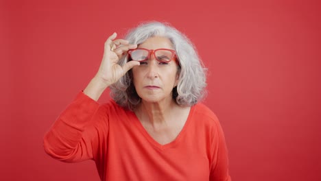 senior woman with red glasses