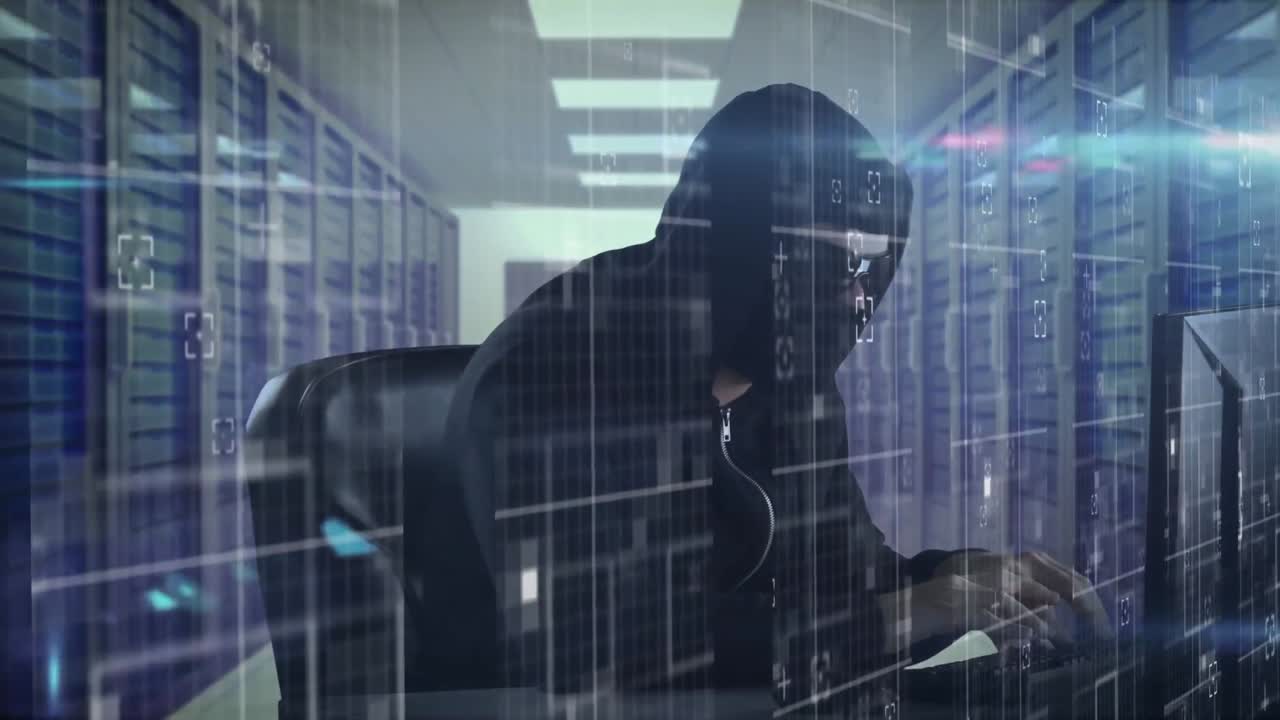 Data processing against male hacker using laptop in server room