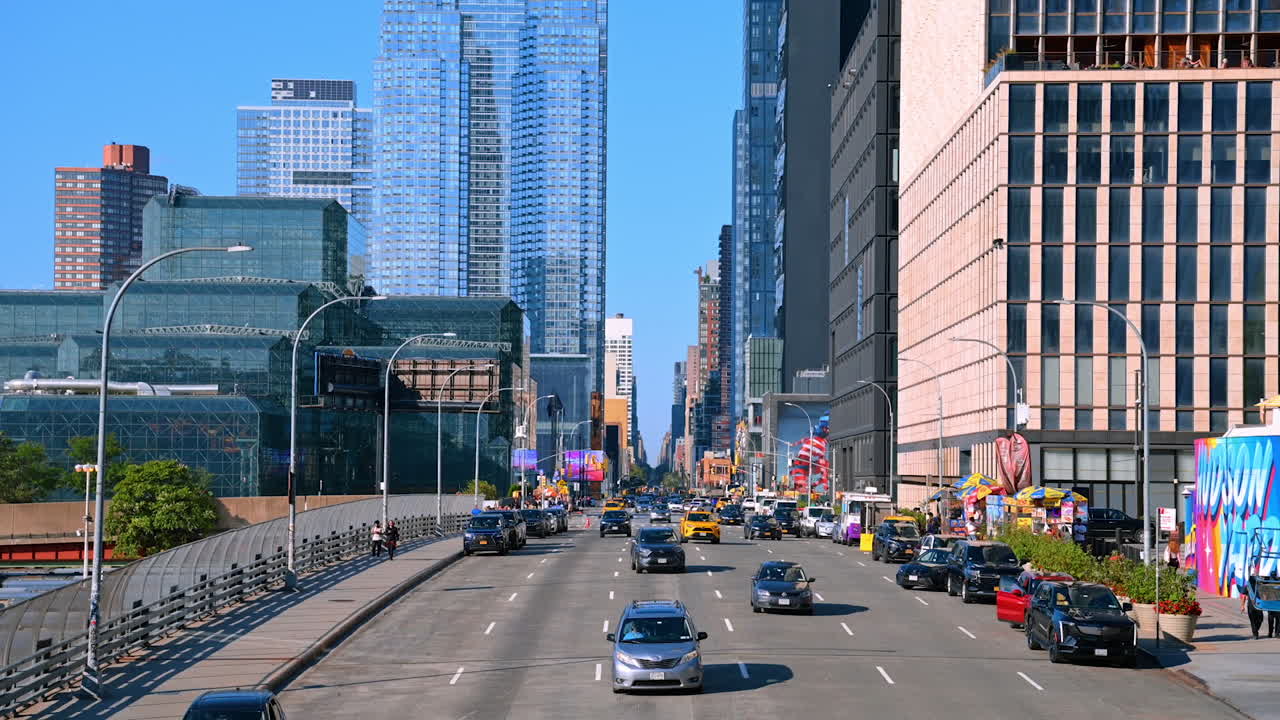 New York, USA, 4 August 2025: Wide avenue leading into Manhattan skyscrapers at Hudson Yards. A busy New York City