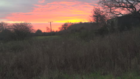 Static-Shot-of-Unused-Farm-Building-at-Golden-Hour-Sunset,-South-Wales-UK