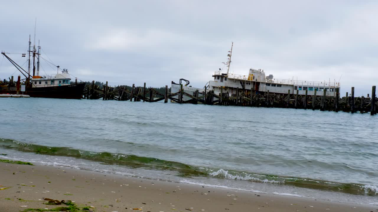 Anchored boat at wooden pier