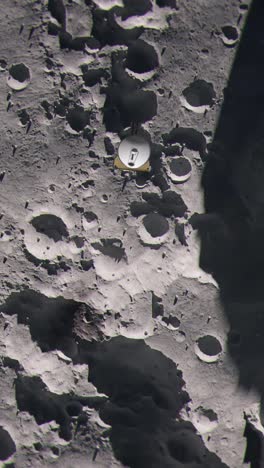 vertical shot of top down aerial view of the moon as a space probe passes over the surface