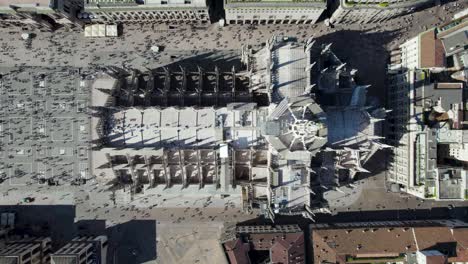 top-down aerial view of iconic milan cathedral and piazza duomo, italy