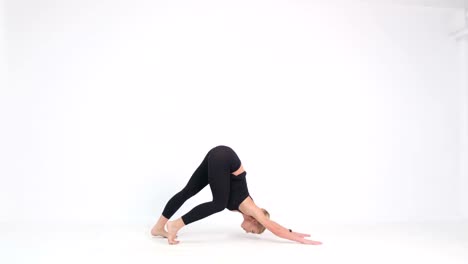young stretching woman doing yoga exercises on mat in living room spending weekend with boyfriend at young stretching woman doing yoga exercises on mat in living room spending weekend with boyfriend at home young man using mobile phone social media