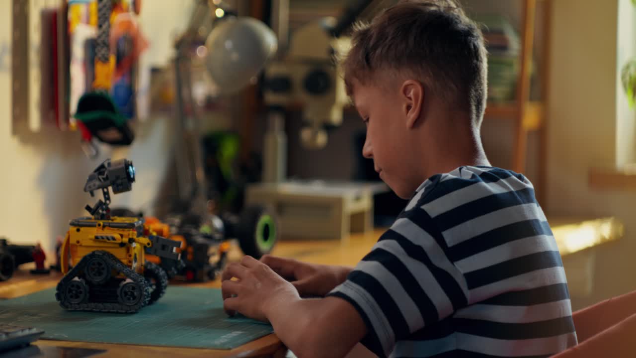 Boy Building a Toy Robot