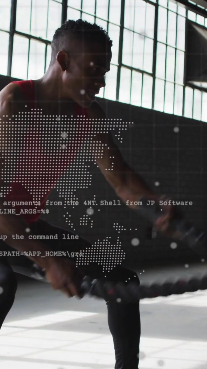 Vertical video: Gripping rope athlete doing arm waves squatting rotating training under map overlay