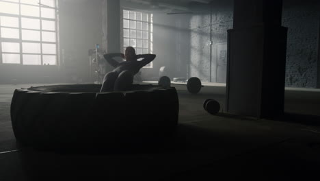athlete performing functional exercises. muscular woman doing abdominal workout
