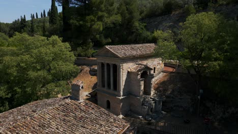 aerial view of temple of clitumnus, flying over roof tiles and chimney