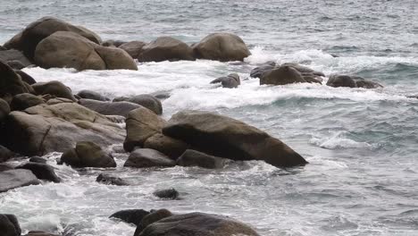 ocean waves crashing against a rocky coast