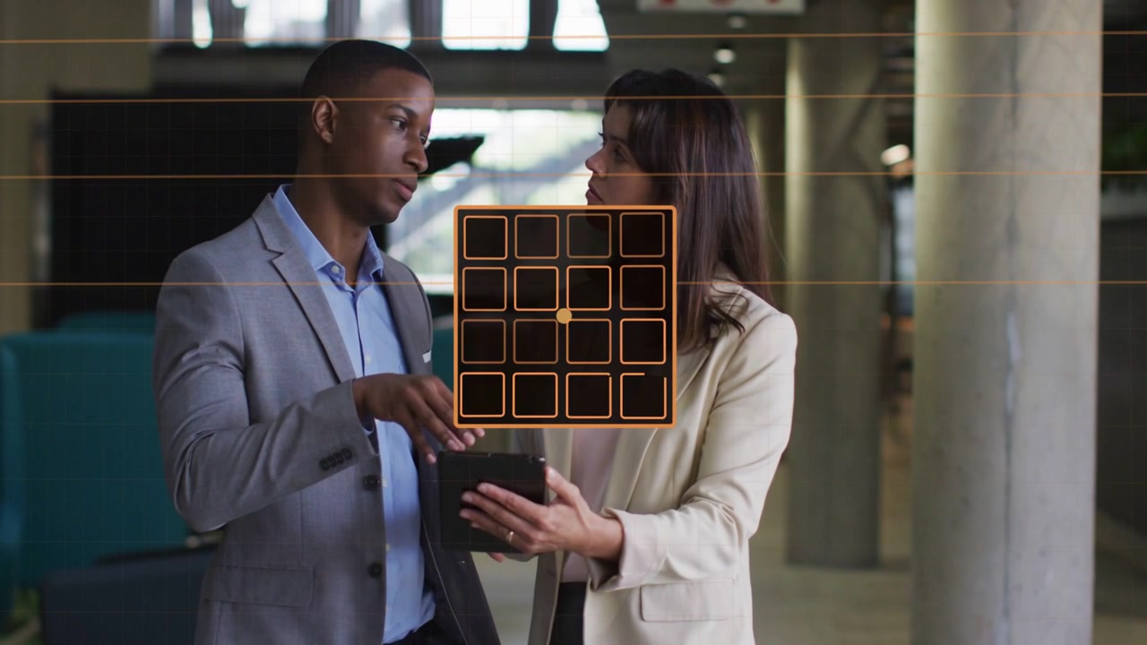 Man tapping tablet causing orange HUD morphing into 5x5 grid, colleagues analyzing BANKS and MEMORY