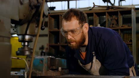 metalsmith working in workshop 4k