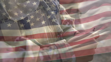 animation of flag of usa over biracial male soldier