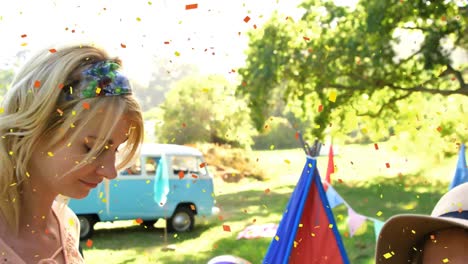 Animation-of-confetti-falling-over-people-dancing-at-summer-camp