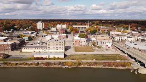 riverside of saginaw, michigan, usa and saginaw river, aerial opening shot