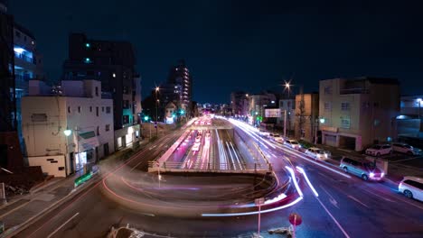 a night timelapse of the traffic jam at the city street in tokyo wide shot