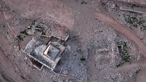 Old-church-emerged-from-swampy-waters-of-Sau-Basin-during-dry-season,-Catalonia-in-Spain