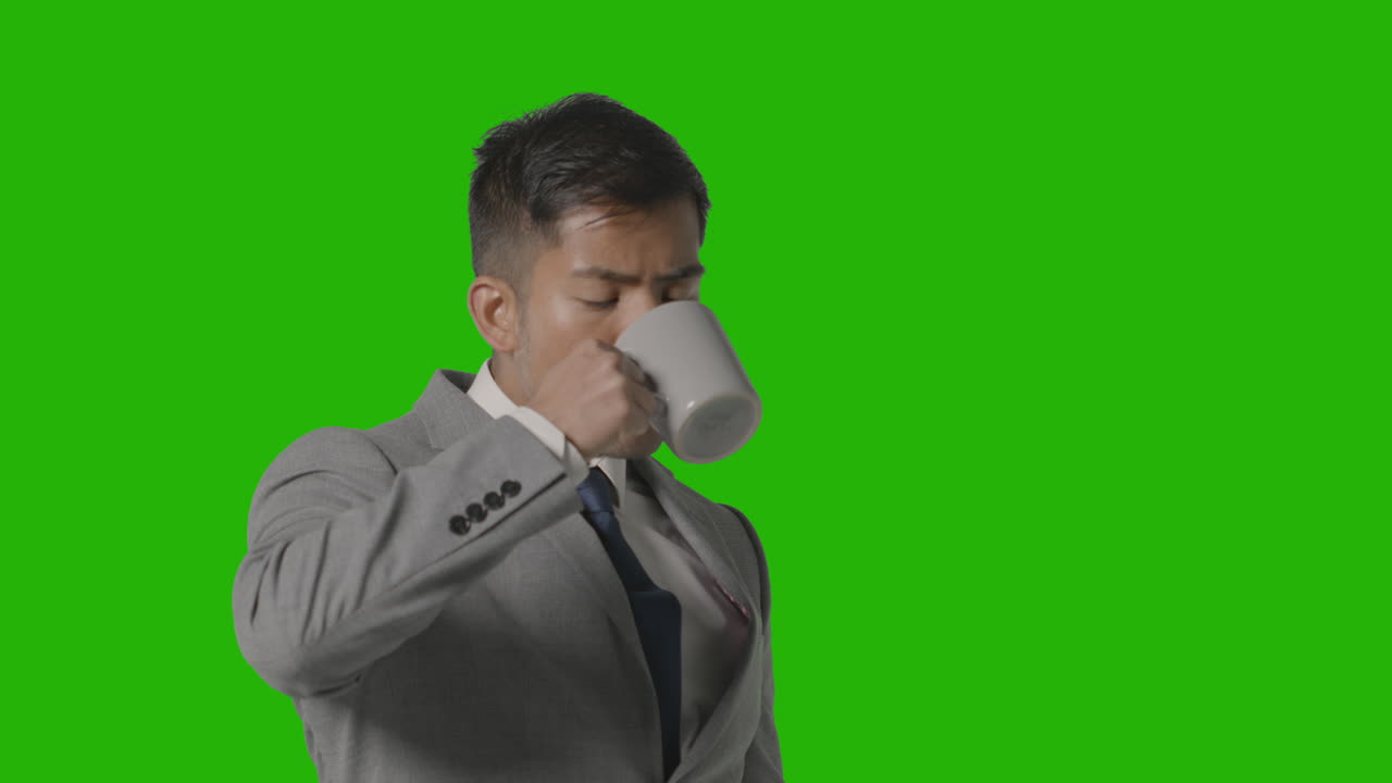 Studio Shot Of Businessman In Suit Holding Cup Of Hot Drink Against Green  Screen 2 Free Stock Video Footage Download Clips