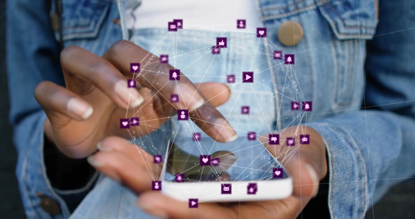 Animation of connected icons forming globe over midsection of african american woman using cellphone