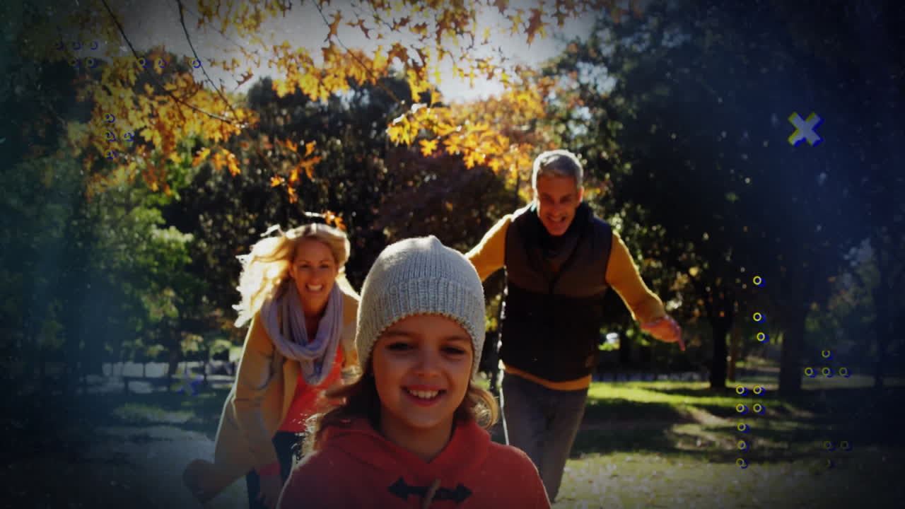 Girl running down autumn park path, parents chasing behind, with floating leaf icons for marketing
