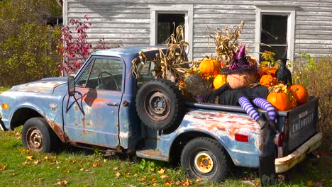 autumn or fall is welcomed in with a homemade halloween display in the back of a pickup truck  1