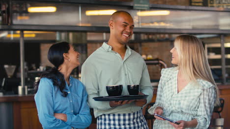 portrait of multi-cultural staff team working in restaurant or coffee shop 1