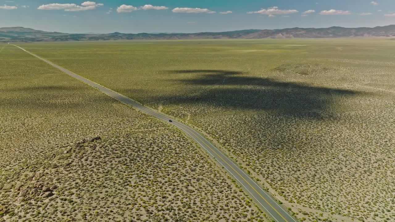 Car driving along a twisting road in the Valley