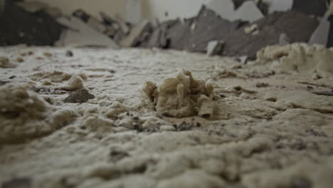 close up shot of old mineral wool under floor screed in an old building