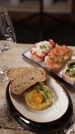 appetizer platter with liver pate and other snacks