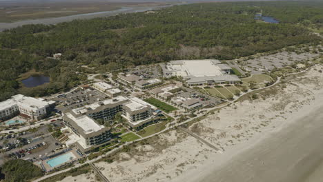 Jekyll-Island-Georgia-Aerial-v5-birdseye-shot-of-waterside-resort,-forest-and-shore---March-2020