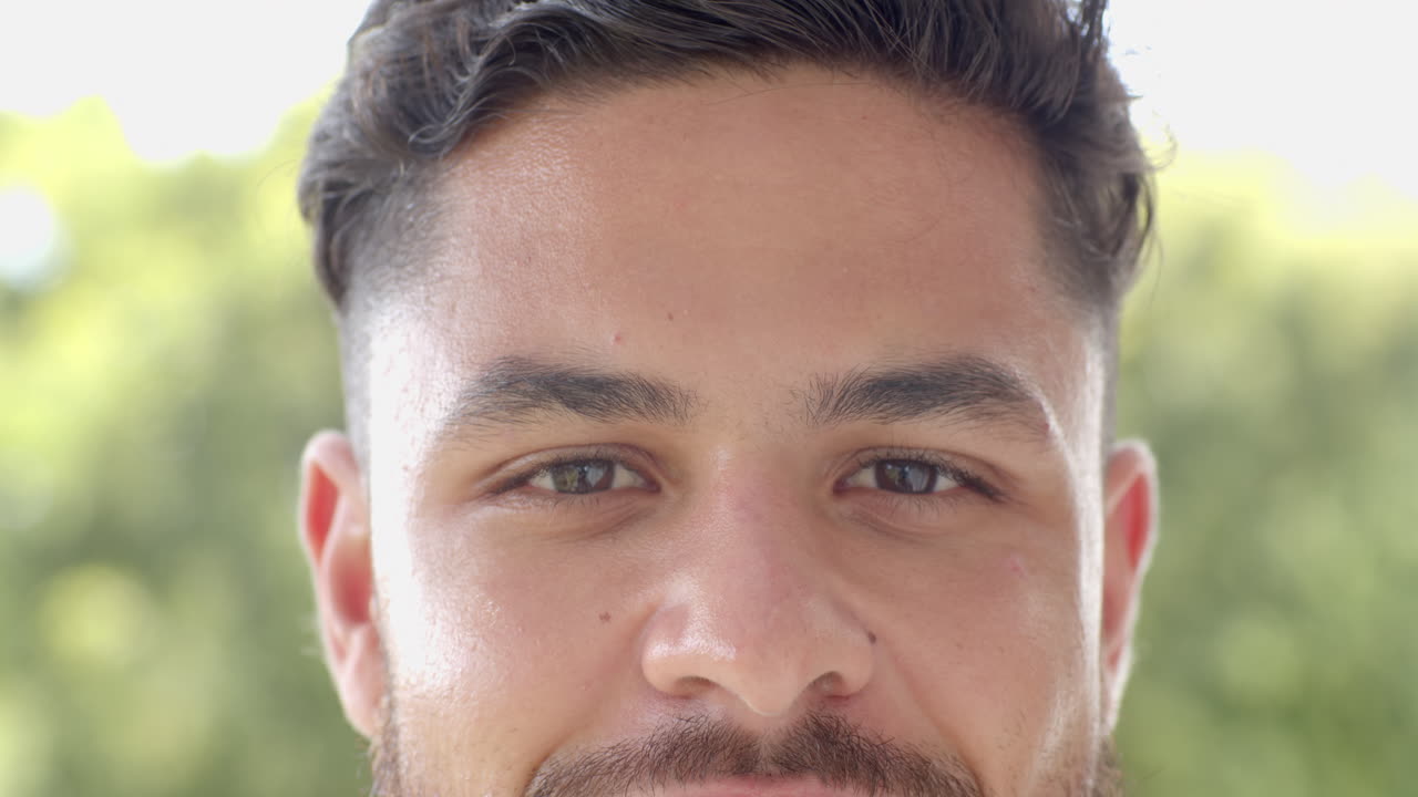 Close-up of person's face with neutral expression, focusing on eyes and lips