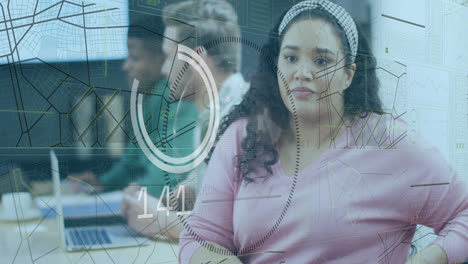 Animation of data processing and spinning globe over biracial woman sitting on her desk at office