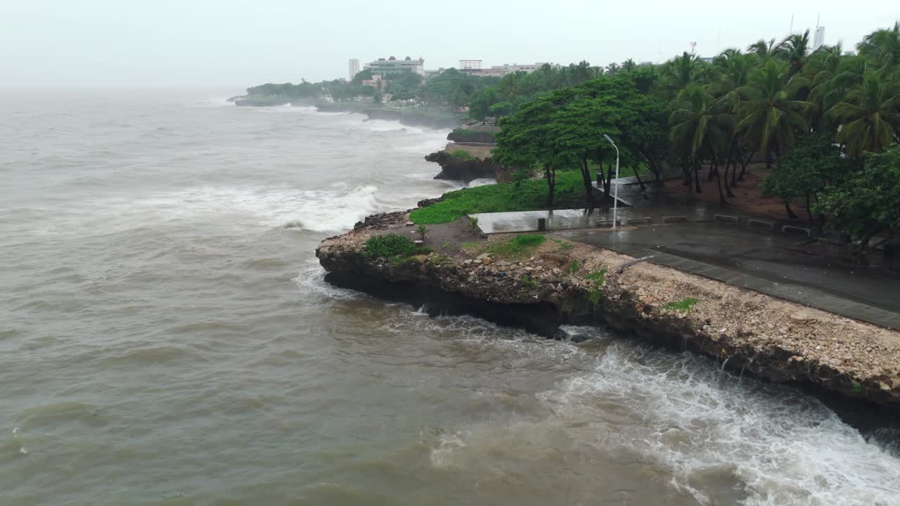 Waves Crashing On Coast of Malecon Of Santo Domingo During Tropical Storm Melissa In Dominican Republic. aerial shot
