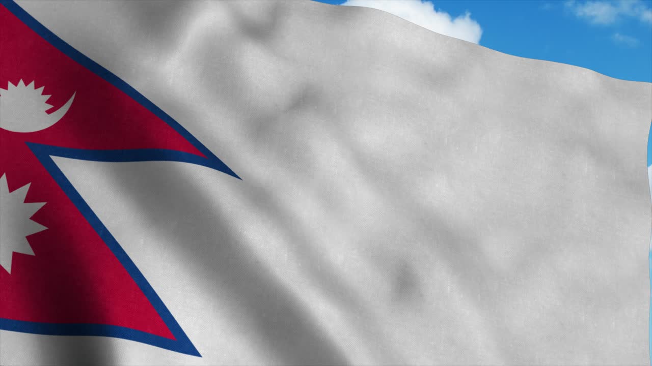 Nepal flag on a flagpole waving in the wind, blue sky background. 4K