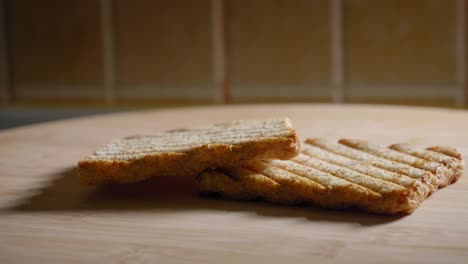 slices of bread on a wooden platter, cooking scrambled eggs - truck shot