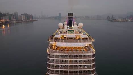 drone lifting shot of cruise ship mein schiff 5 arriving in hong kong in morning dawn