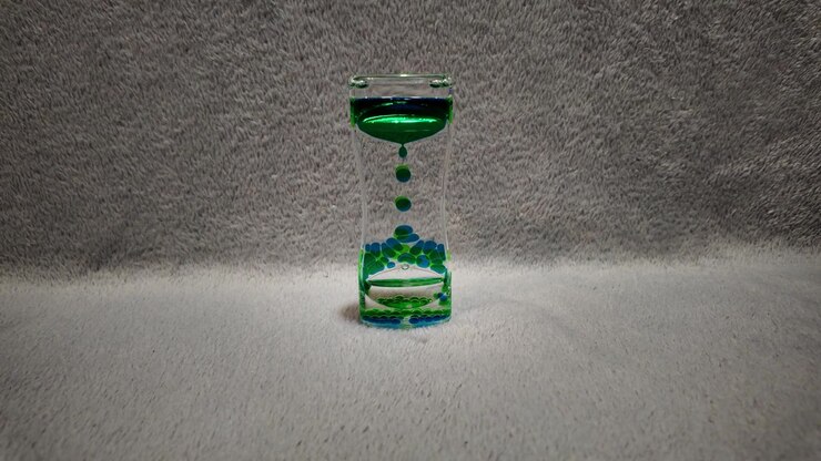 Colorful liquid hourglass with flowing bubbles