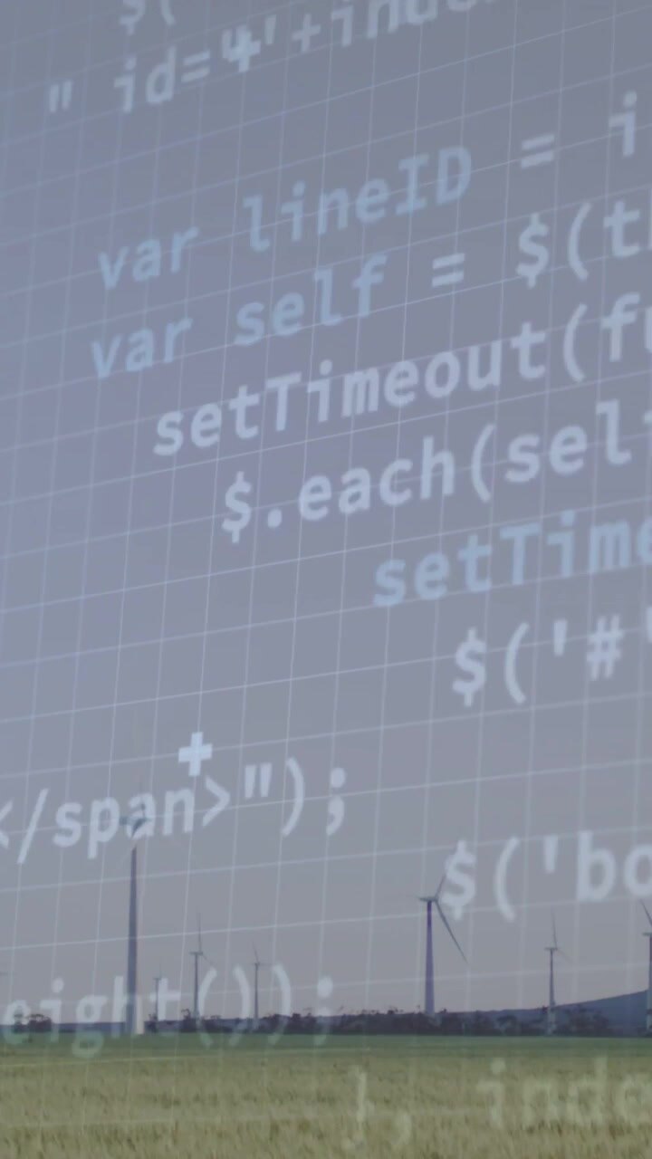 Vertical video: On data feed, grid and code overlay pulsing above wind turbines monitoring power