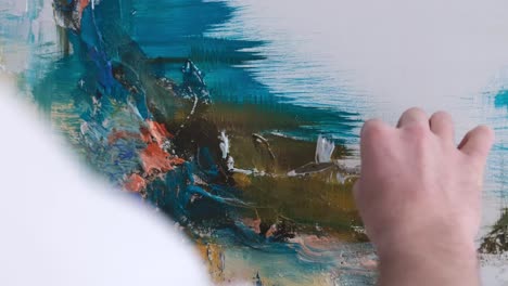 a closeup of an artist using a brush to create a modern masterpiece of oil painting a closeup of an artist using a brush to create a modern masterpiece of oil painting the process of creating an abstract painting video
