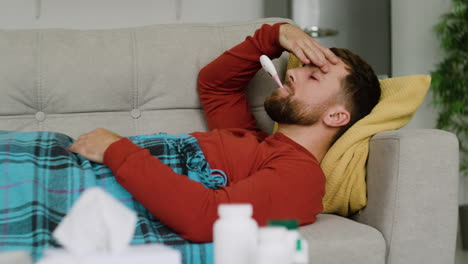 sick man laying on the sofa