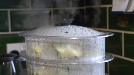 steaming veg cooking in a veg steamer