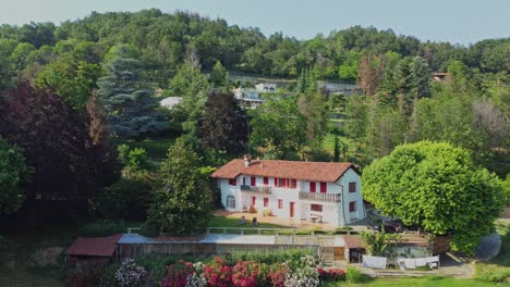 a luxurious italian villa surrounded by trees and beautiful landscape