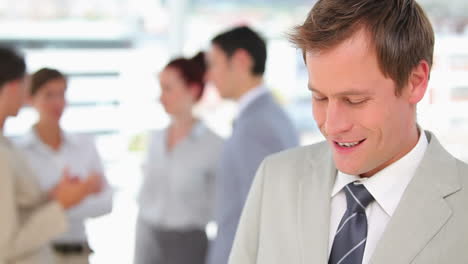 Businessman-looking-down-and-then-at-the-camera