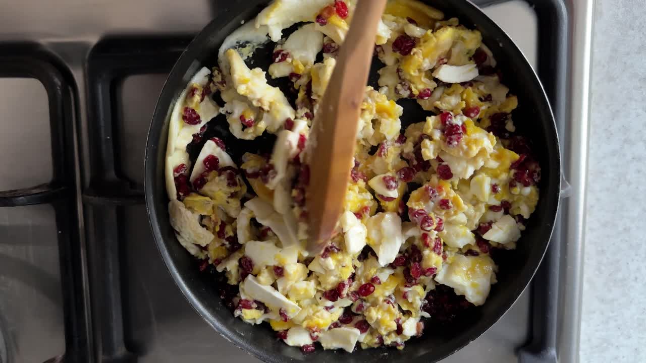 Cooking Omelet for breakfast in Persian cuisine style egg butter frying pan barberries stove delicious gourmet culinary lifestyle organic garlic steak seasoning recipe Tehran kitchen pancake village