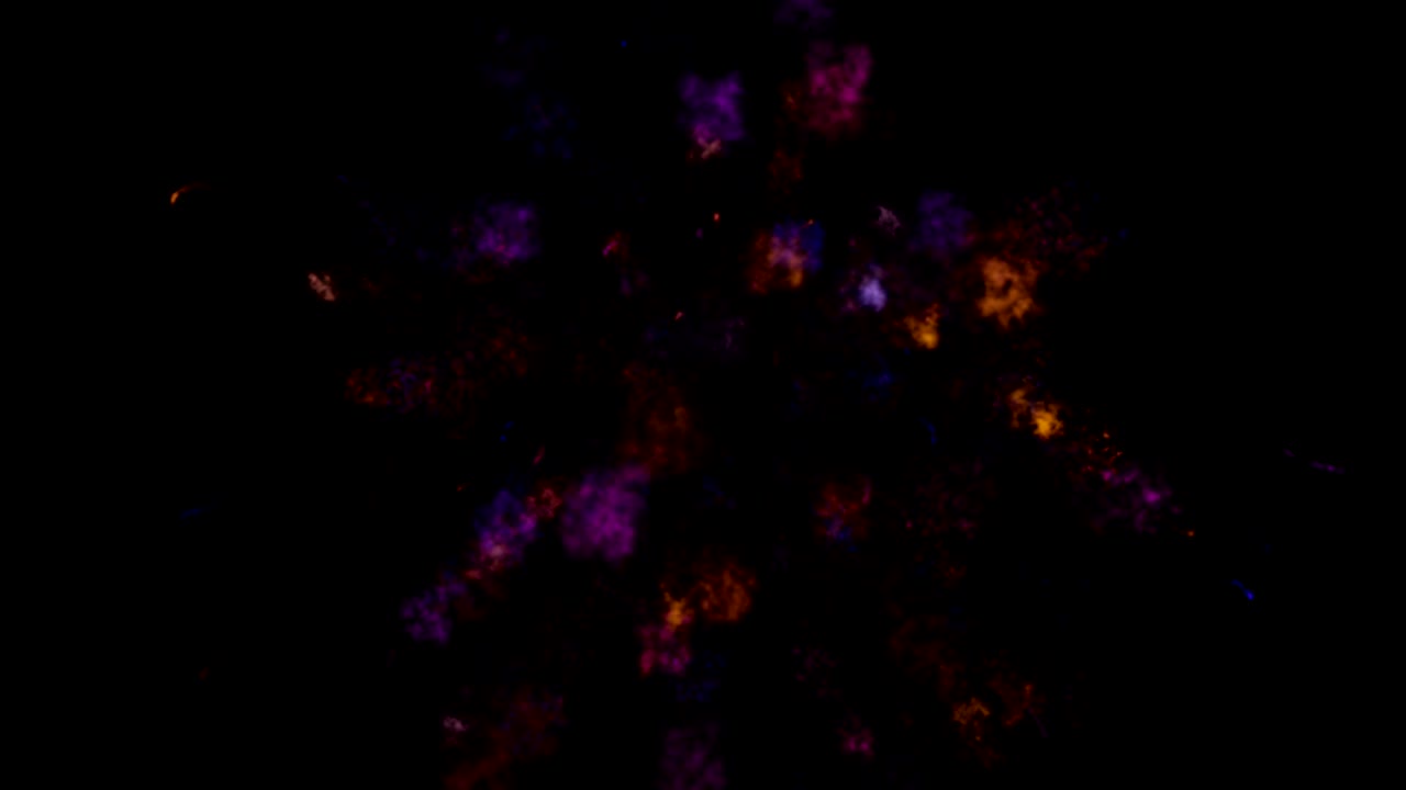 explosión de polvo colorido en fondo negro en bucle