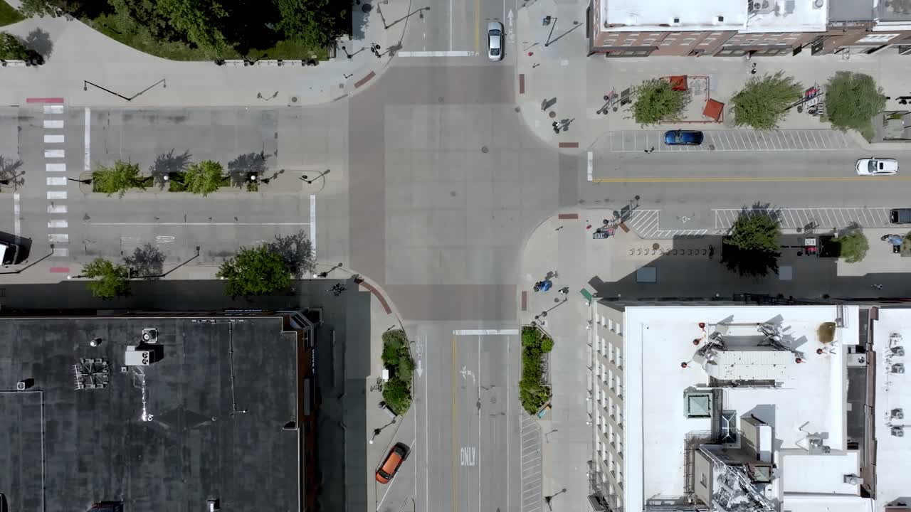 Intersection in Iowa City, Iowa with drone video looking down and moving forward