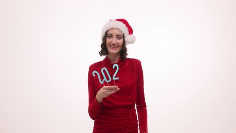 woman in santa hat celebrating new year 2023