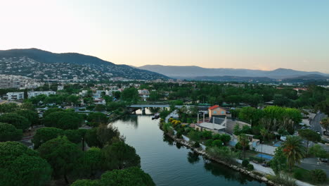 aerial serenity: la siagne river with mandelieu backdrop