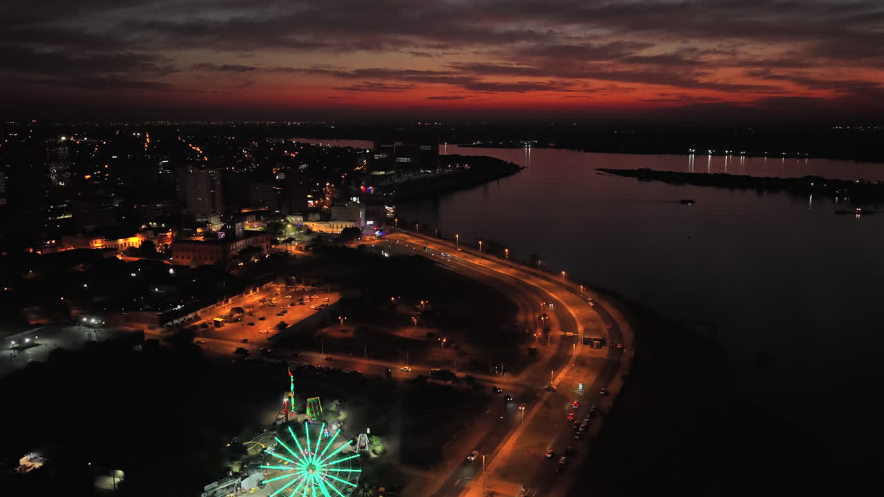 Night View Of Costanera de Asunción Modern And Popular Public Space Along The Paraguay River In Asunción, Paraguay. Aerial Shot