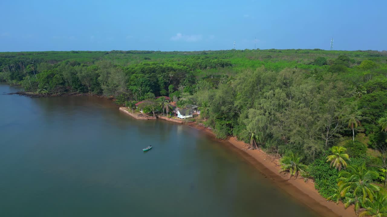 Small fishing boat floating near tropical coast of Koh Mak island, Thailand. Marvelous aerial view flight panorama overview drone